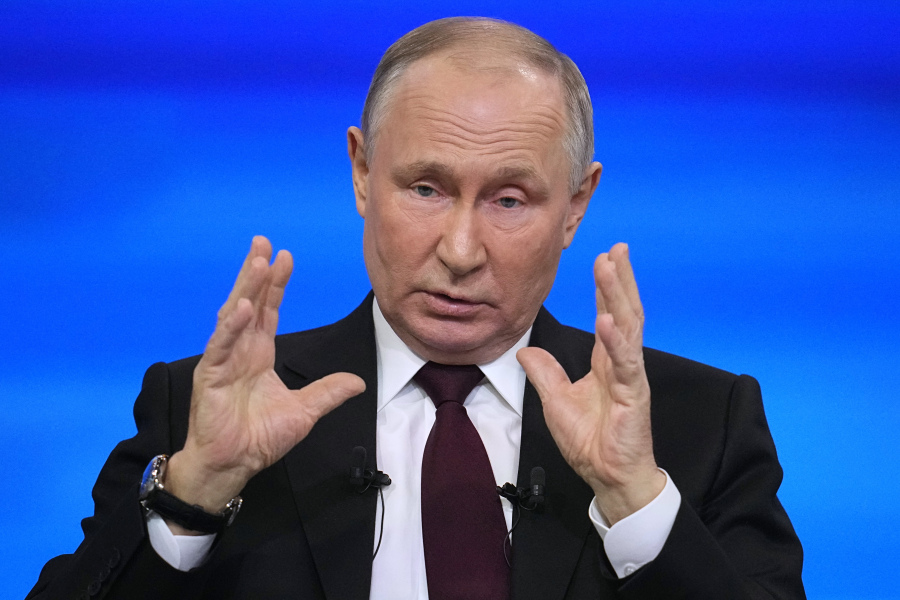Russian President Vladimir Putin gestures during his annual news conference in Moscow, Russia, Thursday, Dec. 14, 2023.