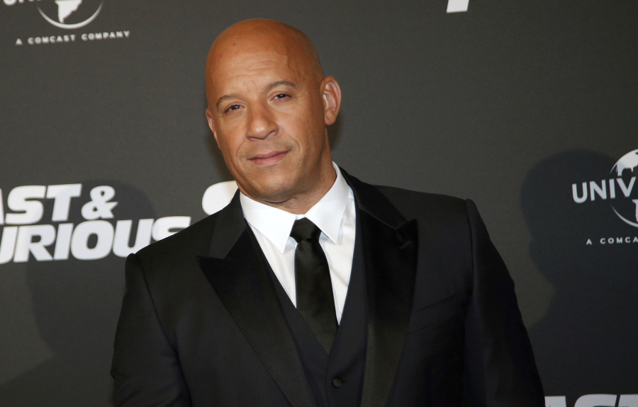 FILE - Vin Diesel poses during the premiere of Fast and Furious 8, in Paris, April 5, 2017.  The actor has been accused by his former assistant of sexual battery while working for him in 2010. Astra Jonasson filed a lawsuit in Los Angeles on Thursday, Dec.