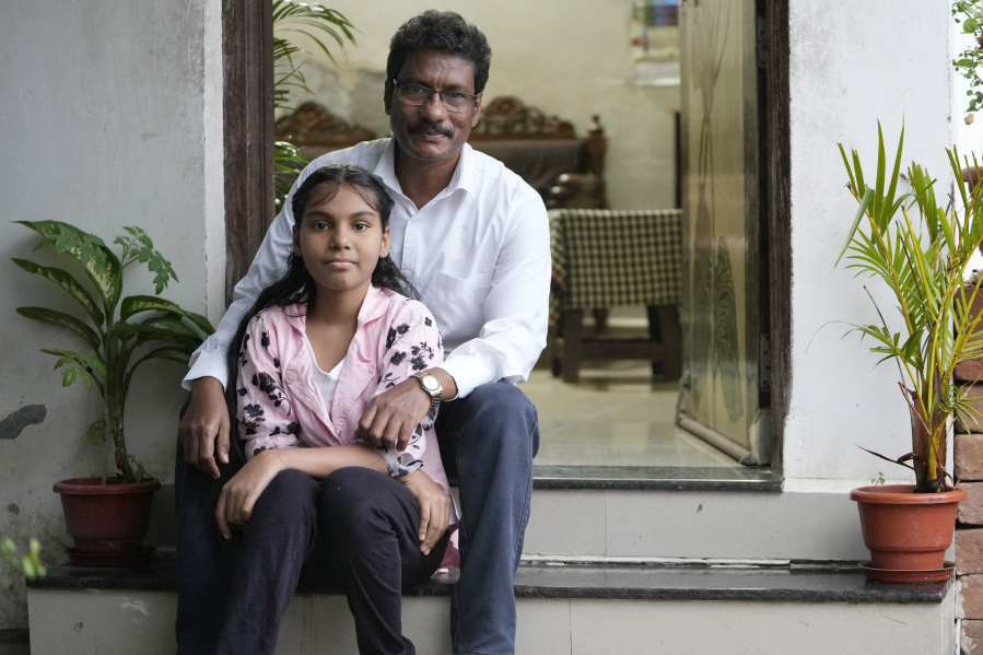 Gautam Dongre, of the National Alliance of Sickle Cell Organizations, sits for a portrait with his daughter, Sumedha, 13, at their residence in Nagpur, India, Wednesday, Dec. 6, 2023. Dongre recalls how his newborn son, Girish, cried constantly from stomach and leg pain. Doctors couldn&rsquo;t figure out what was wrong and didn&rsquo;t diagnose him with sickle cell for 2 1/2 years. When Sumedha was born, he and his wife had her tested immediately and learned she had the disease too.