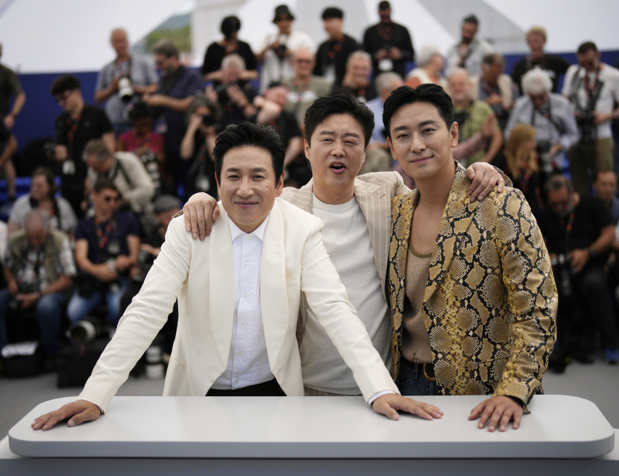 FILE - Lee Sun-kyun, from left, Kim Hee-won and Ju Ji-hoon poses for photographers at the photo call for the film &lsquo;Project Silence&rsquo; at the 76th international film festival, Cannes, southern France, on May 22, 2023. Police says actor Lee Sun-kyun of the Oscar-winning &ldquo;Parasite&rdquo; has been found unconscious. Seoul police said police officers discovered an unconscious Lee at an unidentified Seoul site on Wednesday, Dec. 27, but gave no further details.