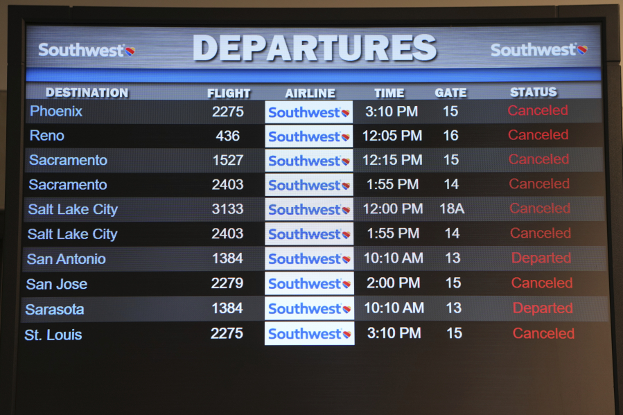 FILE - Canceled Southwest Airlines flights are displayed in red on the departures monitor at the Southwest terminal at the Los Angeles International Airport, Dec. 27, 2022. Southwest Airlines will pay a $35 million fine as part of a $140 million agreement to settle a federal investigation into a debacle last December when the airline canceled thousands of flights and stranded more than 2 million travelers over the holidays.