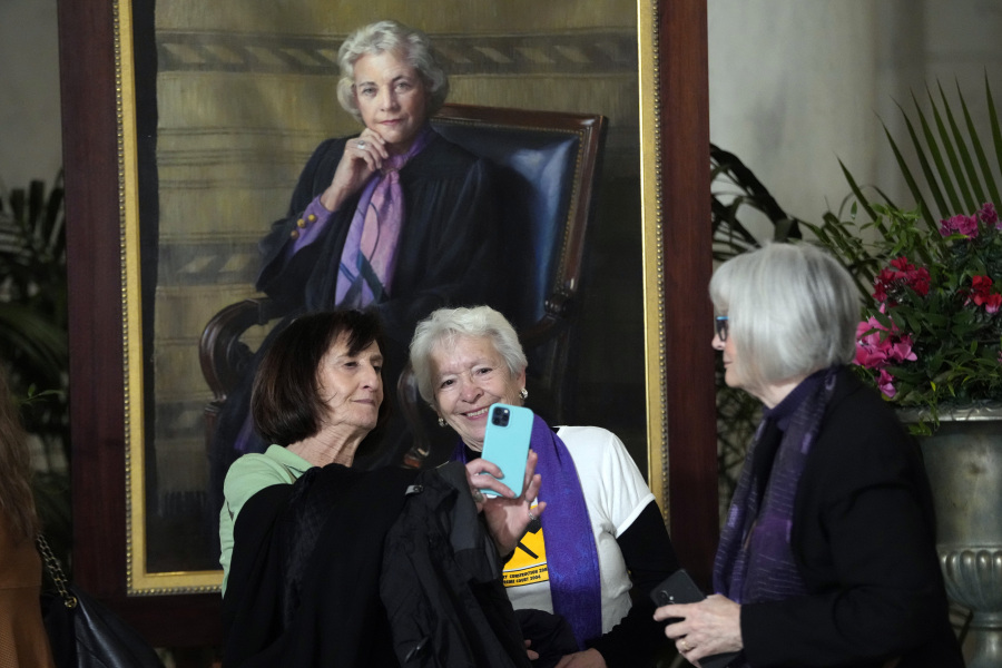 Dega Schembri, left, and Sheridan Harvey take a photo during the public repose for retired Supreme Court Justice Sandra Day O&rsquo;Connor in the Great Hall at the Supreme Court in Washington, Monday, Dec. 18, 2023. O&rsquo;Connor, an Arizona native and the first woman to serve on the nation&rsquo;s highest court, died Dec. 1 at age 93. Former law clerks of O&rsquo;Connor stand at left and right. They were both in exercise class with O&rsquo;Connor.