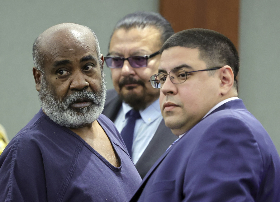 FILE - Duane &ldquo;Keffe D&rdquo; Davis, left, with deputy special public defenders Robert Arroyo, right, and Charles Cano, rear, appears for his arraignment at the Regional Justice Center, Nov. 2, 2023, in Las Vegas. The former Los Angeles-area gang leader accused of murder in the killing of hip-hop music icon Tupac Shakur in 1996 in Las Vegas is seeking to be released to house arrest ahead of his murder trial in June 2024. A Nevada judge on Tuesday, Dec. 19, 2023, set a Tuesday, Jan. 2, 2024, hearing on the request by Davis.