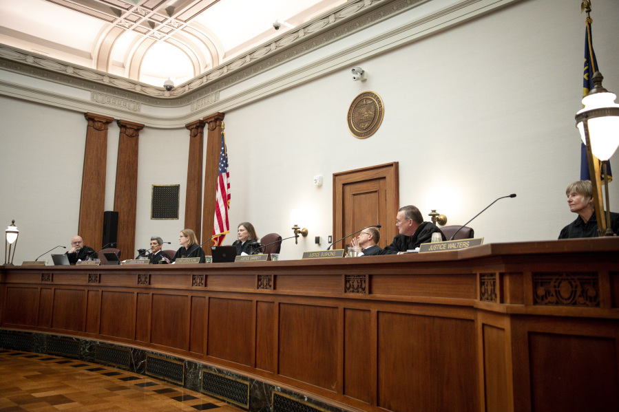Oregon Supreme Court justices listen to the oral arguments made by attorneys representing Republican Oregon senators and the Department of Justice on Thursday, Dec. 14, 2023 in Salem, Ore. Republicans are challenging the implementation of Measure 113, an effort to put a stop to legislative walkouts.