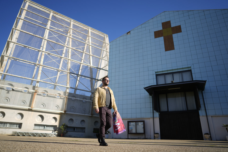 Tiziano Fabi Braga, coordinator of the Mosaiko Christian LGBTQ+ group walks past the Santa Margherita Maria Alacoque parish church on the outskirts of Rome, Tuesday, Dec. 19, 2023. Pope Francis&rsquo; authorization for Catholic priests to offer blessings to same-sex couples is in many ways a de facto recognition of what has been going on in some European parishes for years. But Francis&rsquo; decision to officially spell out his approval could send a message of tolerance to places where gay rights are far less evolved.