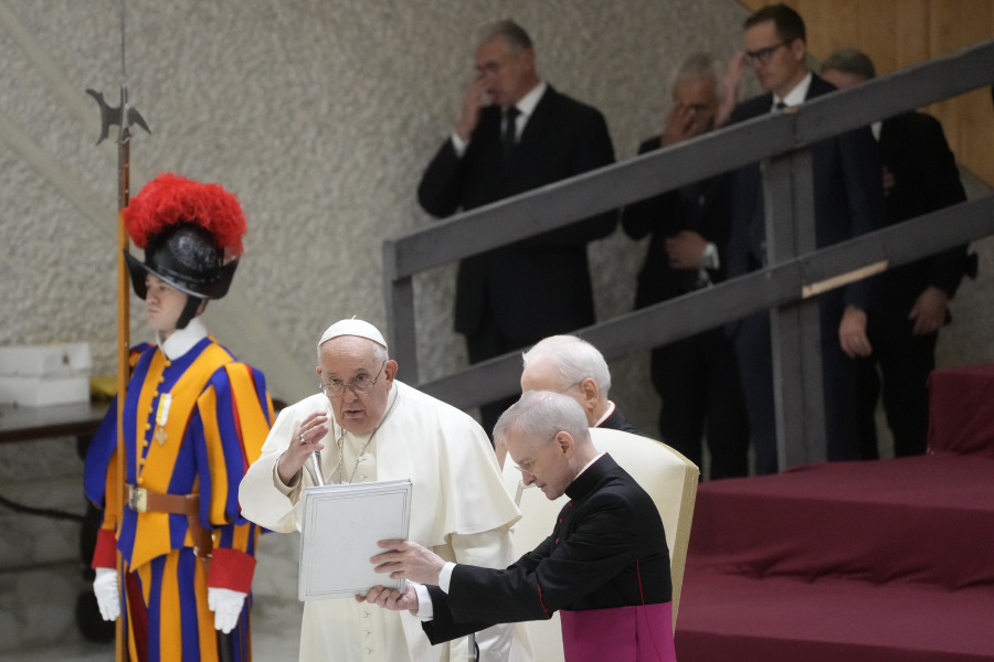 Pope Francis delivers his blessing during the weekly general audience at the Vatican, Wednesday, Dec. 13, 2023.