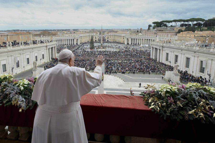 Pope Francis waves to faithful gathered for the Urbi et Orbi (Latin for &lsquo;to the city and to the world&rsquo; ) Christmas&rsquo; day blessing from the main balcony of St. Peter&rsquo;s Basilica at the Vatican, Monday Dec. 25, 2023.