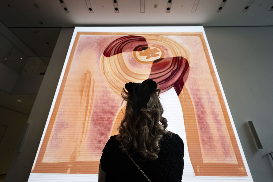 A visitor looks at artist Refik Anadol&rsquo;s &ldquo;Unsupervised&rdquo; exhibit at the Museum of Modern Art, on Jan. 11 in New York. The AI-generated installation was meant to be a thought-provoking interpretation of the museum&rsquo;s prestigious collection.