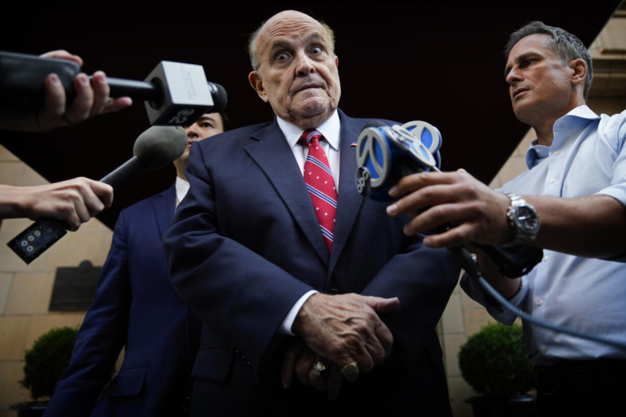 Former Mayor of New York Rudy Giuliani speaks to reporters as he leaves his apartment building in New York on Aug. 23, 2023.