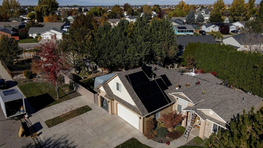 Sun Driven Solar installs solar panels onto the roof of a Nampa, Idaho, home, on Nov. 3, 2022.