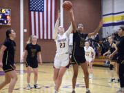 Hudson’s Bay’s Avi Desjarlais (24) and Columbia River’s Kaya Mirtich (23) attempt to grab a loose ball during a 2A Greater St. Helens League girls basketball game on Wednesday, Jan. 3, 2024, at Columbia River High School.