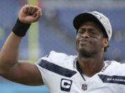 Seattle Seahawks quarterback Geno Smith celebrates after the Seahawks defeated the Tennessee Titans in an NFL football game on Sunday, Dec. 24, 2023, in Nashville, Tenn.