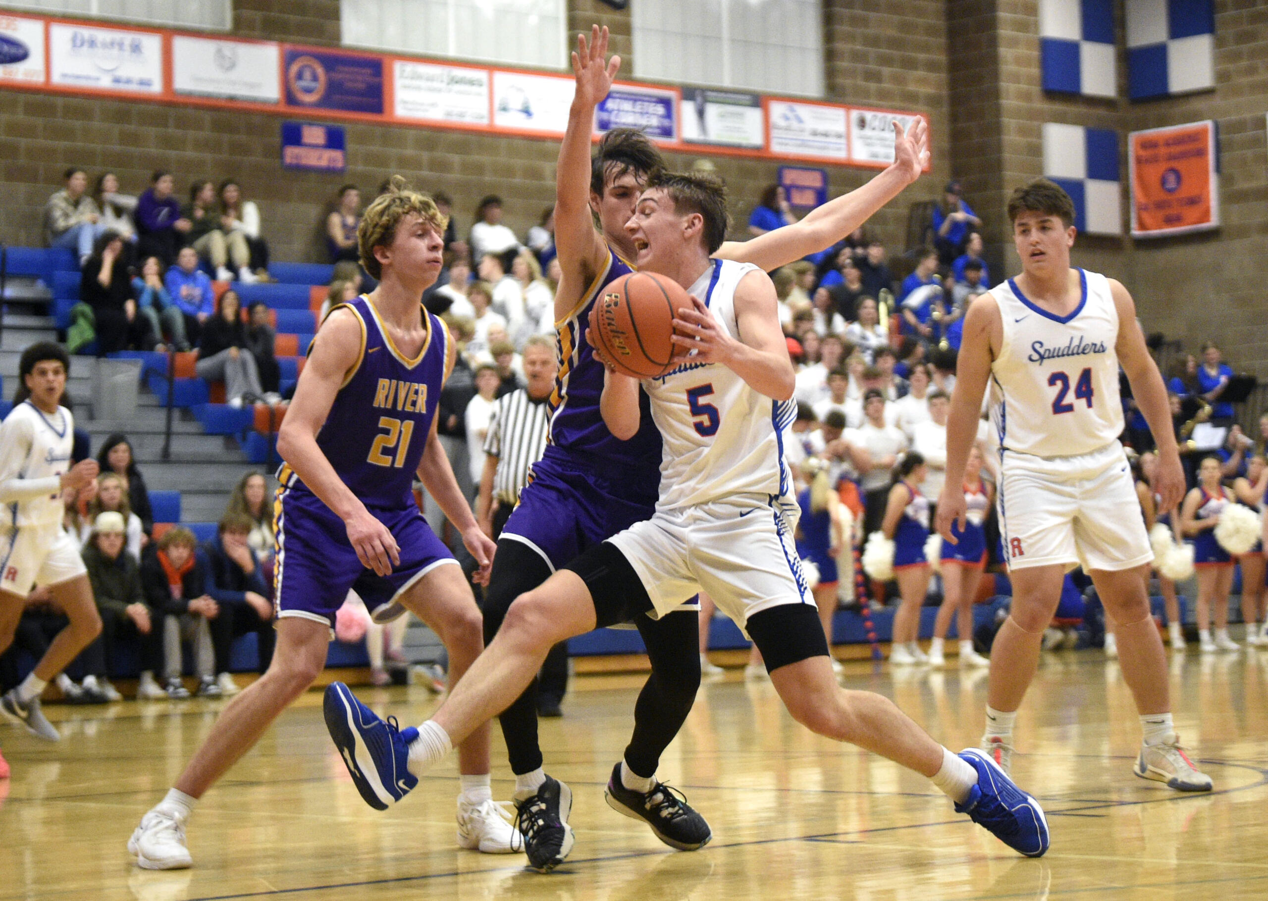 Ridgefield’s Jamison McCann drives toward the basket during a 2A Greater St. Helens League boys basketball game against Columbia River on Thursday, Jan. 4, 2024, at Ridgefield High School.
