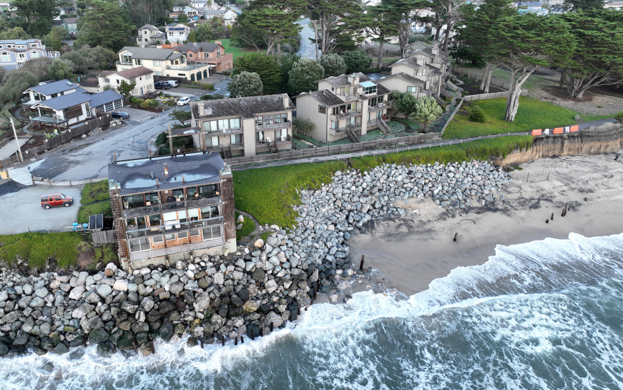 Condominiums, to the right of the building in the foreground, are seen in this drone view near Miramar Beach in Half Moon Bay, California, on Dec. 7, 2023. The condo owners sued the Coastal Commission and won when it wouldn&rsquo;t let them build a sea wall, and the case is now on appeal.