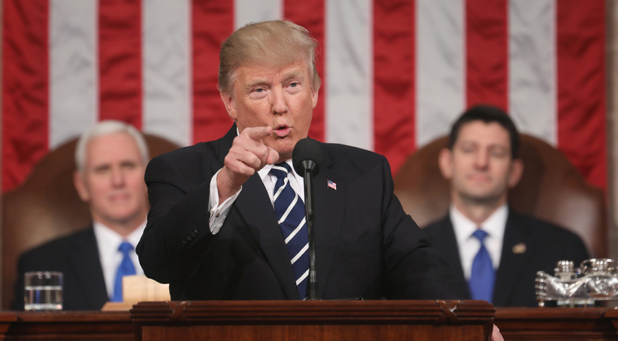U.S. President Donald J. Trump (center) delivers his first address to a joint session of the U.S. Congress as U.S. Vice President Mike Pence (left) and Speaker of the House Paul Ryan (right) listen on Feb. 28, 2017, in the House chamber of the U.S. Capitol in Washington, DC. Trump&rsquo;s first address to Congress is expected to focus on national security, tax and regulatory reform, the economy, and healthcare.
