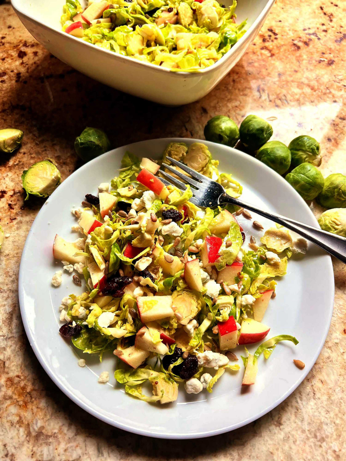 Shaved Brussels sprouts team up with chopped apple and a citrusy dressing in this healthful salad.