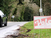 Drivers pass a sign supporting Camas School District&rsquo;s replacement levies, near the corner of Northwest Lake Road and Northwest Sierra Street.