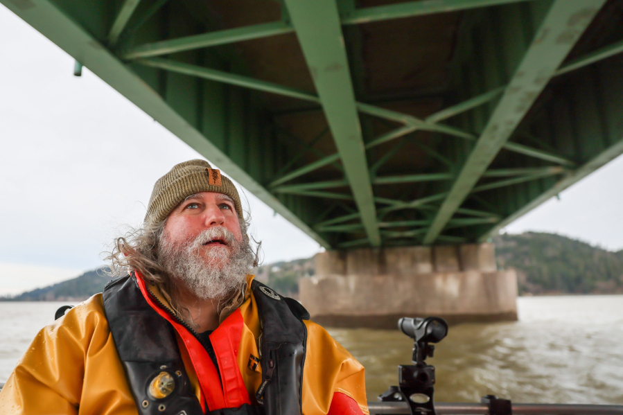 Bob Sallinger, executive director of Bird Conservation Oregon, touring the Astoria-Megler Bridge, issued warnings years ago about relocating cormorants from Sand Island. Photographed Dec. 13, 2023, on the waters of the Columbia River in  Astoria, Oregon.