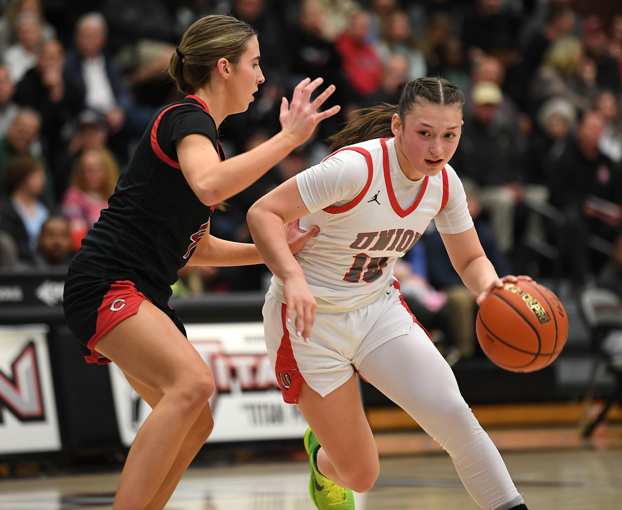 Union sophomore Brooklynn Haywood, right, moves around Camas junior Sophie Buzzard on Tuesday, Jan. 2, 2024, during the Titans’ 65-43 loss to Camas at Union High School.