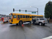 An SUV crashed into a school bus Wednesday morning in the Image neighborhood, injuring four people. Two students and the driver of the SUV were taken to area hospitals in ambulances, and another student&rsquo;s parents drove them to the hospital.