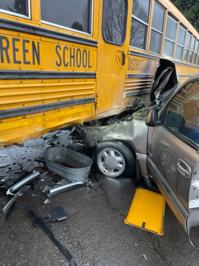 An SUV crashed into a school bus Wednesday morning in the Image neighborhood, injuring four people. The SUV reportedly caught on fire, but a witness extinguished it with a fire extinguisher.
