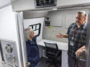 U.S. Sen. Patty Murray, left, listens to Cowlitz Indian Tribe Manager Michael Watkins talk about the tribe's new mobile treatment van at the Cowlitz Indian Tribe's Vancouver clinic.