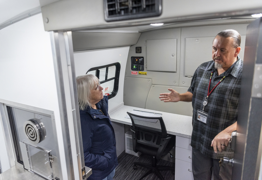 U.S. Sen. Patty Murray, left, listens to Cowlitz Indian Tribe Manager Michael Watkins talk about the tribe's new mobile treatment van at the Cowlitz Indian Tribe's Vancouver clinic.