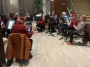 Woodwinds Anonymous, made up of current and former members of the Vancouver Community Concert Band, played a Christmas concert in the lobby of the Hilton Vancouver Washington on Nov.