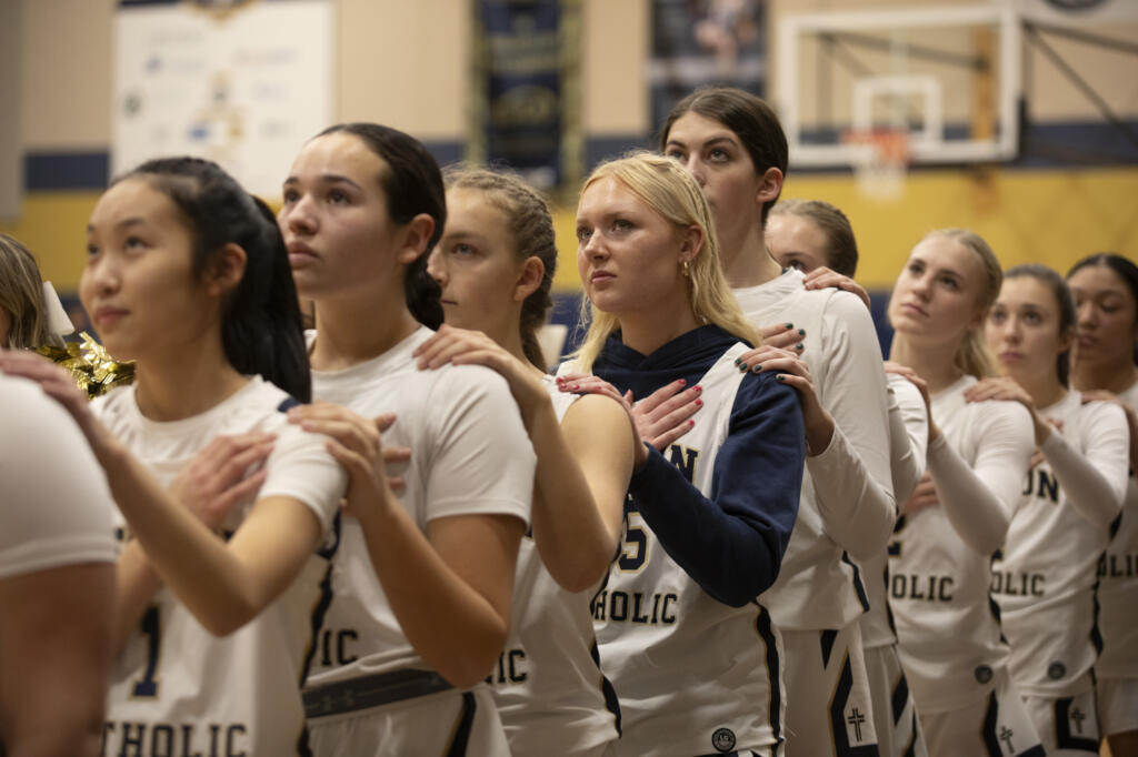 Seton Catholic girls basketball players stand for the national anthem before a game against King’s Way at Seton Catholic High School on Thurs. Jan. 11, 2024. Seton Catholic defeated King's Way 36-22.