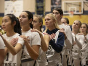 Seton Catholic girls basketball players stand for the national anthem before a game against King’s Way at Seton Catholic High School on Thurs. Jan. 11, 2024. Seton Catholic defeated King's Way 36-22.