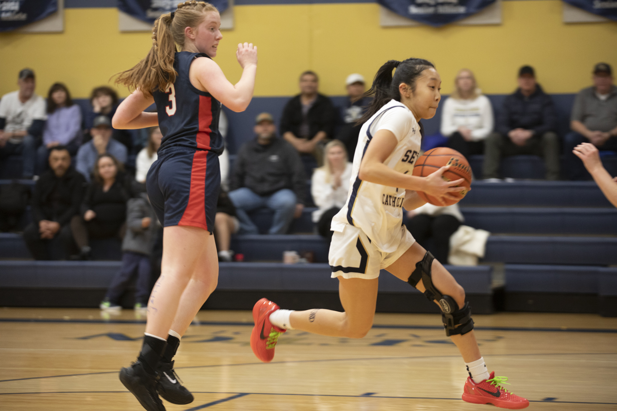 Madison Lee (1) of Seton Catholic (right) heads down the court with King’s Way’s Bridget Quinn (3) just behind her 4during a Trico League girls basketball game at Seton Catholic High School on Thurs. Jan. 11, 2024. Seton Catholic defeated King's Way 36-22.