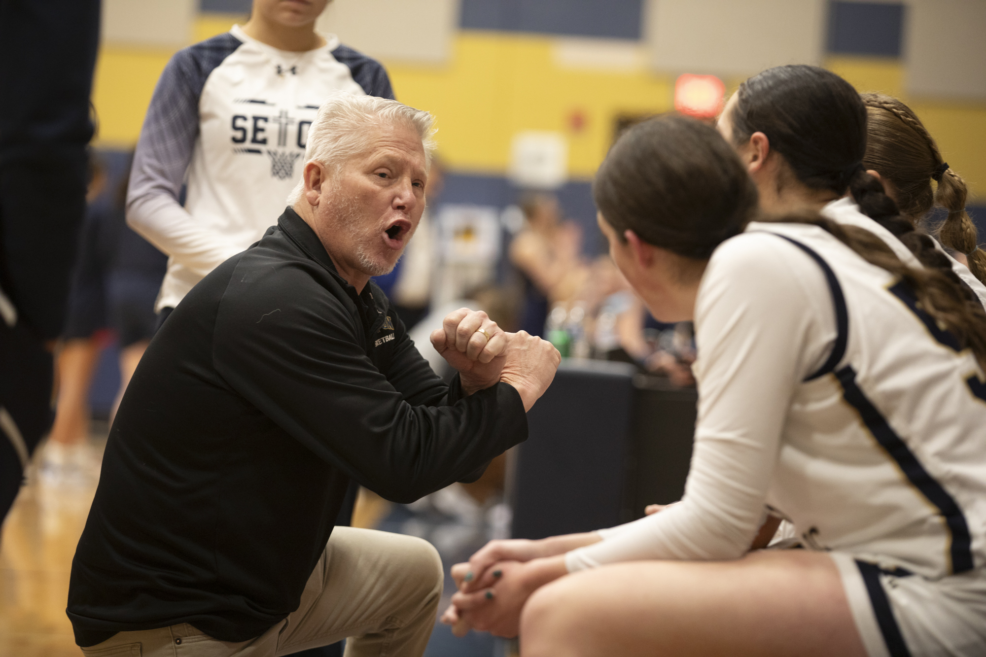 Seton Catholic's head coach Joe Potter talks to the team during a time out in a Trico League girls basketball game against King's Way at Seton Catholic High School on Thurs. Jan. 11, 2024. Seton Catholic defeated King's Way 36-22.