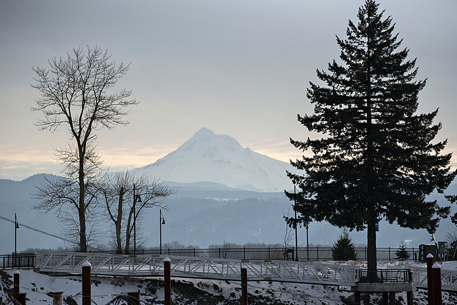 Mount Hood, seen from the Port of Camas-Washougal on Tuesday morning, shows a fresh coat of white after the weekend&rsquo;s winter storm. The Western United States experienced record low snow in early January.