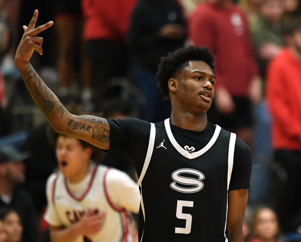 Skyview senior Demaree Collins celebrates a three Tuesday, Jan. 23, 2024, during the Storm’s 69-66 loss to Camas at Camas High School.