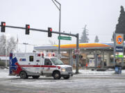 An ambulance responds to a call in southeast Vancouver during an ice storm Jan. 17.
