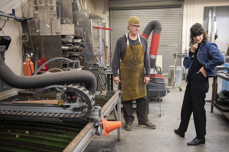 Washougal High School’s Don O'Brien, left, chats with Rep. Marie Gluesenkamp Perez during a tour of the metals and small engine repair program on Wednesday morning, Jan. 24, 2024.