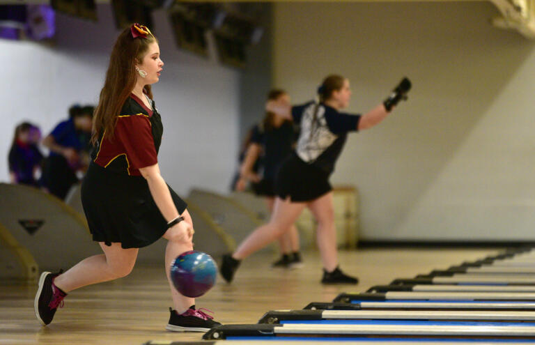 Prairie’s Izabella Hewes, left, bowls Friday, Jan. 26, 2024, during the WIAA District 4 3A/4A championships at Hazel Dell Lanes.