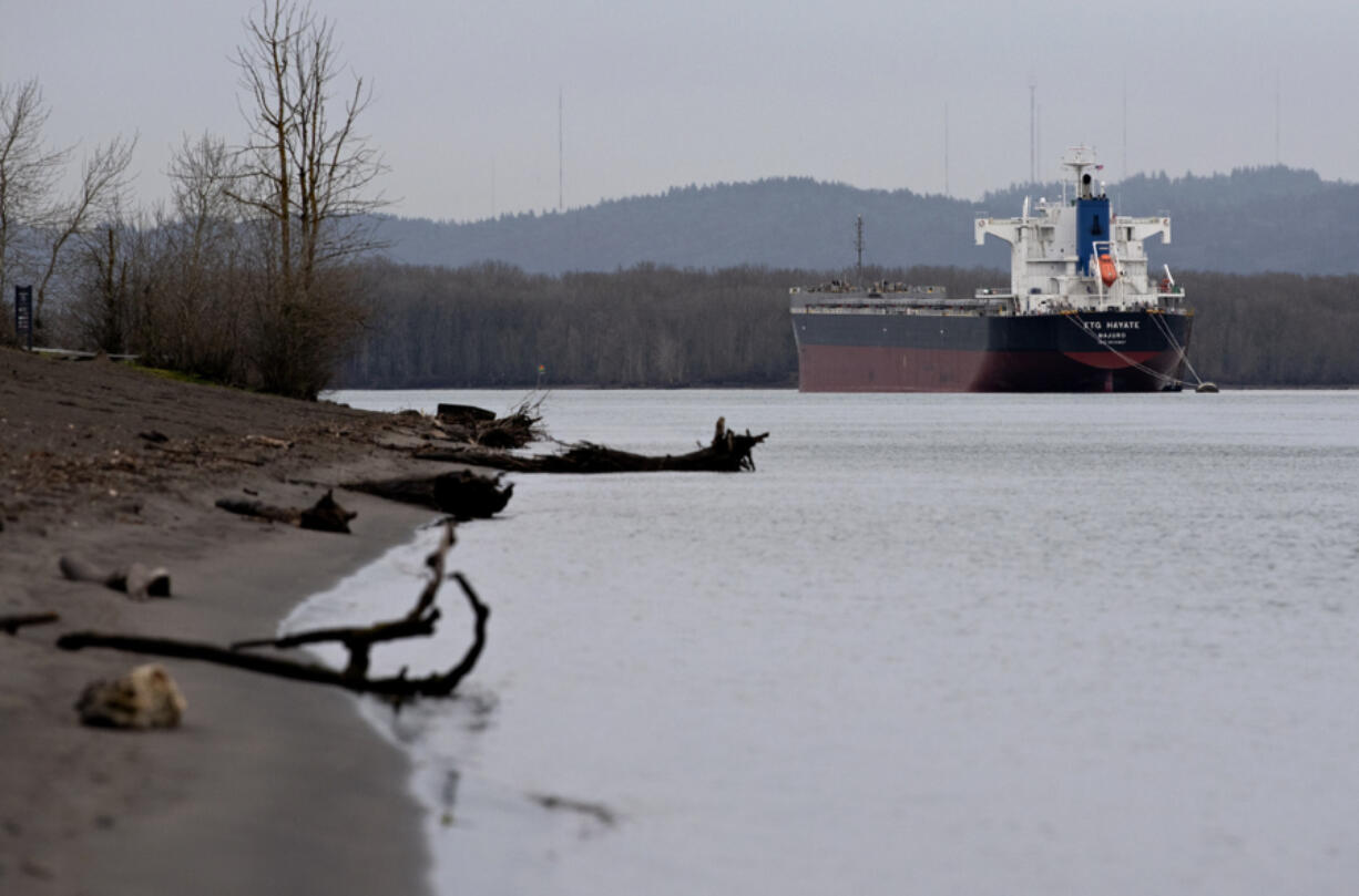A ship cruises past the shoreline at Frenchman&rsquo;s Bar Regional Park under overcast, drizzly conditions Friday morning. With daytime temperatures expected to reach the upper 50s and even low 60s beginning Sunday, melting snow from higher elevations could raise river levels.