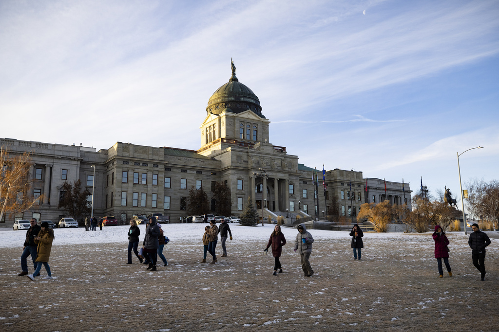 Staff evacuate from the Montana State Capitol, Wednesday morning, Jan. 3, 2023, after a bomb threat.