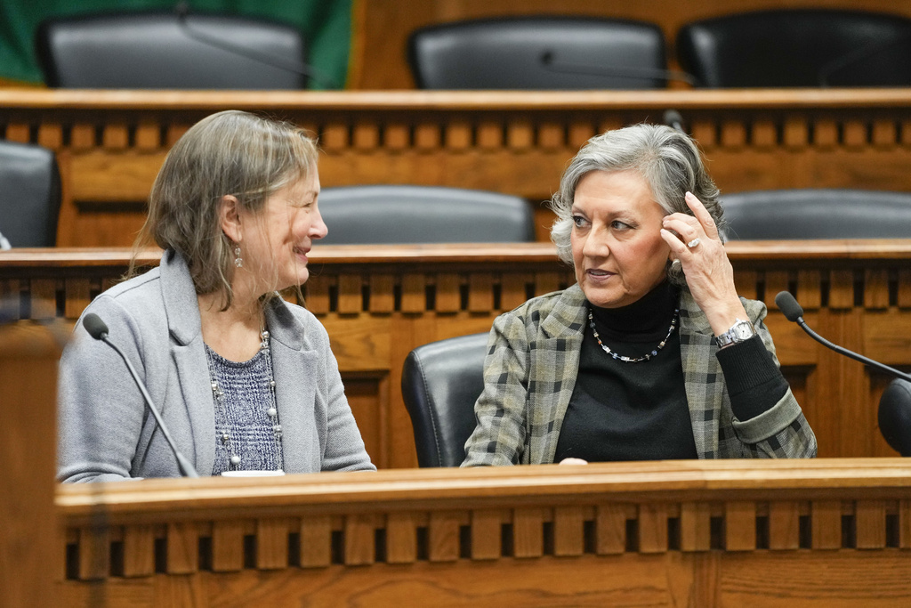Sen. June Robinson, D-Everett, chair of Senate Ways and Means Committee, left, talks with Sen. Lynda Wilson, R-Vancouver, ranking minority member of Senate Ways and Means Committee, at right, during a legislative session preview in the Cherberg Building at the Capitol Thursday, Jan. 4, 2024 in Olympia, Wash.