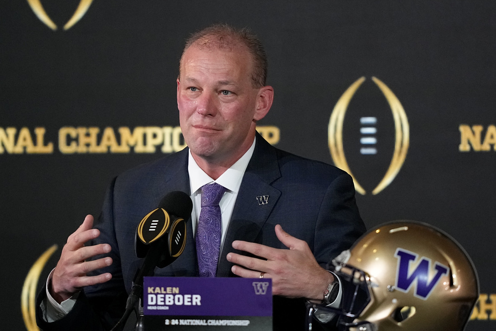 Washington head coach Kalen DeBoer speaks during a news conference ahead of the national championship NCAA College Football Playoff game between Washington and Michigan Sunday, Jan. 7, 2024, in Houston. He told his team on Friday, Jan. 12, 2024, that he's leaving to take the head coaching position at Alabama. (AP Photo/David J.