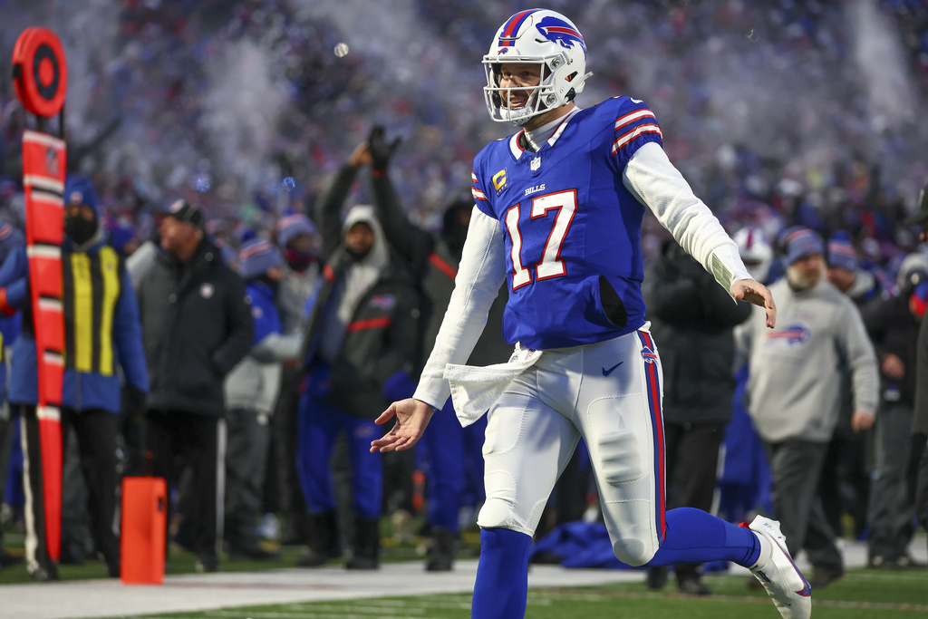 Buffalo Bills quarterback Josh Allen (17) reacts after throwing a touchdown pass to tight end Dalton Kincaid (86) during the first quarter of an NFL wild-card playoff football game, Monday, Jan. 15, 2024, in Buffalo, N.Y. (AP Photo/Jeffrey T.
