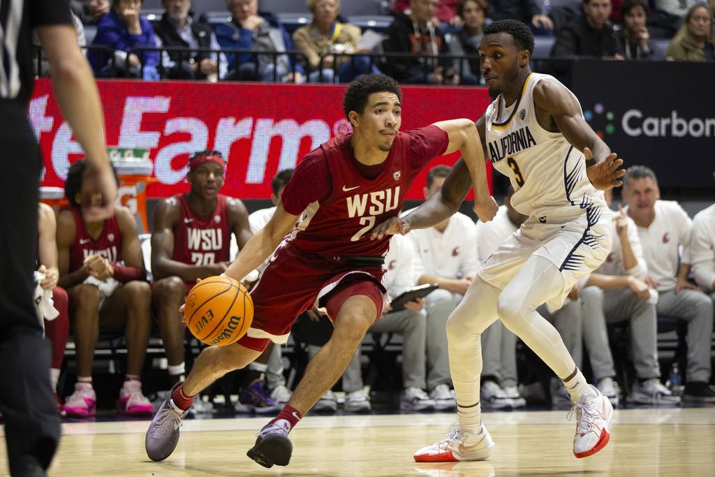 Washington State guard Myles Rice (2) drives past California guard Keonte Kennedy (3) during the second half of an NCAA college basketball game, Saturday, Jan. 20, 2024, in Berkeley, Calif. (AP Photo/D.