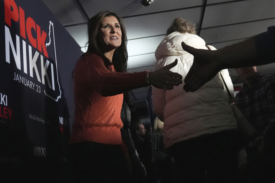 Republican presidential candidate former UN Ambassador Nikki Haley shakes hands with guests at a V.F.W. hall during a campaign stop, Monday, Jan. 22, 2024, in Franklin, N.H.