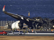 Burnt Japan Airlines plane is seen at Haneda airport on Thursday, Jan. 4, 2024, in Tokyo, Japan. A transcript of communication between traffic control and two aircraft that collided and burst into flames at Tokyo&rsquo;s Haneda Airport showed that only the larger Japan Airlines passenger flight was given permission to use the runway where a coast guard plane was preparing for takeoff.