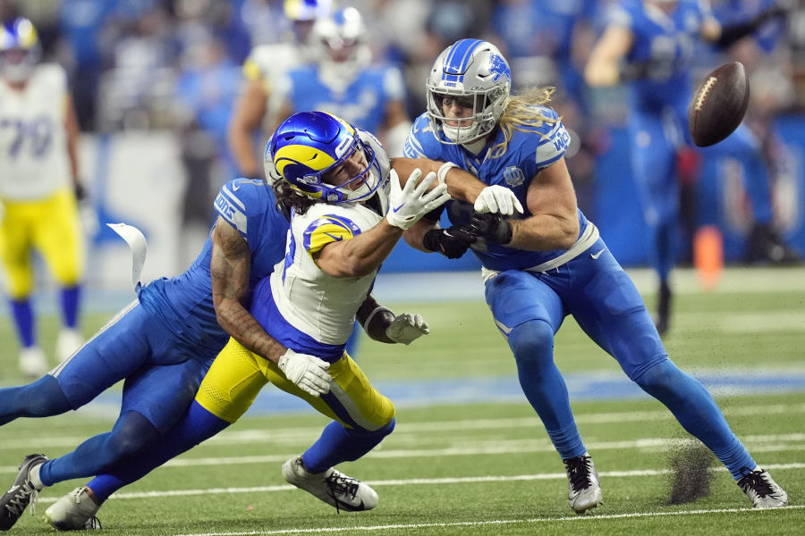 Detroit Lions cornerback Cameron Sutton (1) deflects a pass intended for Los Angeles Rams wide receiver Puka Nacua (17) during the second half of an NFL wild-card playoff football game, Sunday, Jan. 14, 2024, in Detroit.