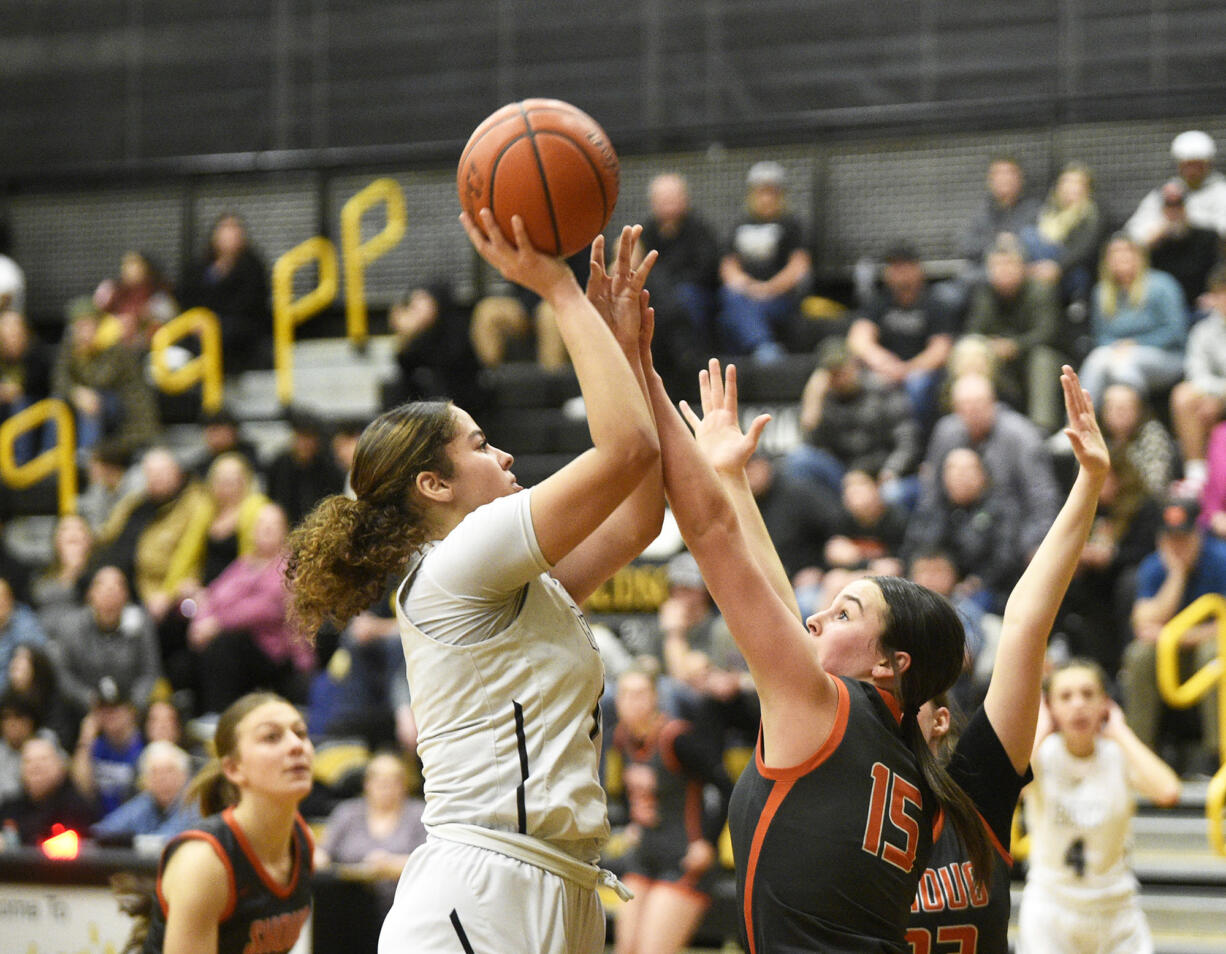 Alana Stephens of Hudson’s Bay (left) shoots over Jenna Klopman of Washougal (15) during a 2A Greater St. Helens League girls basketball game at Hudson’s Bay High School on Monday, Jan. 29, 2024.