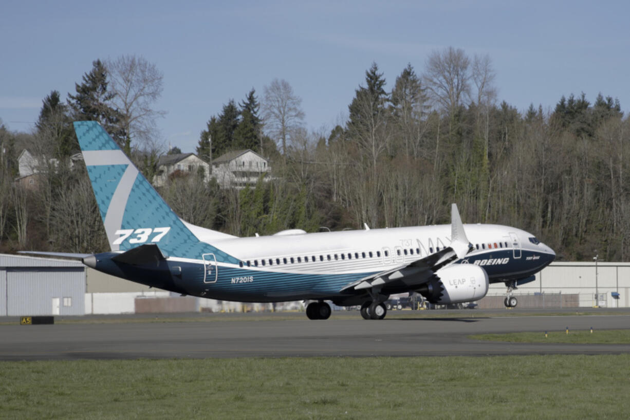 FILE - A Boeing 737 MAX 7 takes off on its first flight on March 16, 2018, in Renton, Wash. Facing severe criticism after a door plug blew out on a 737 Max over Oregon this month, Boeing said Monday, Jan. 29, 2024, that it is withdrawing a request for a safety exemption needed to certify the new model of the plane.