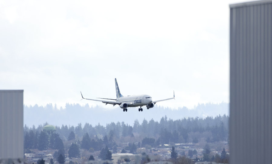 An Alaska Airlines Boeing 737-990ER flight 337 from Fort Lauderdale, Fla., lands at Portland International Airport in Portland, Ore., Saturday, Jan. 6, 2024. The FAA has ordered the temporary grounding of Boeing 737 MAX 9 aircraft after part of the fuselage blew out during a flight.