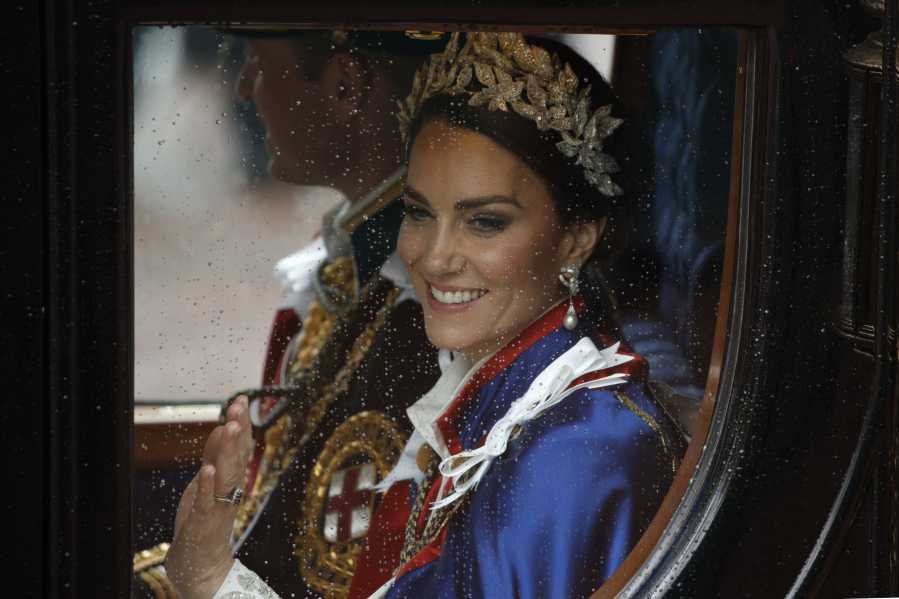 FILE - Kate, Princess of Wales, and Prince William travel in a coach following the coronation ceremony of Britain&rsquo;s King Charles III in London, Saturday, May 6, 2023. The Princess of Wales has been hospitalized for planned abdominal surgery and will remain at The London Clinic for up to two weeks, Kensington Palace said Wednesday, Jan. 17, 2024.